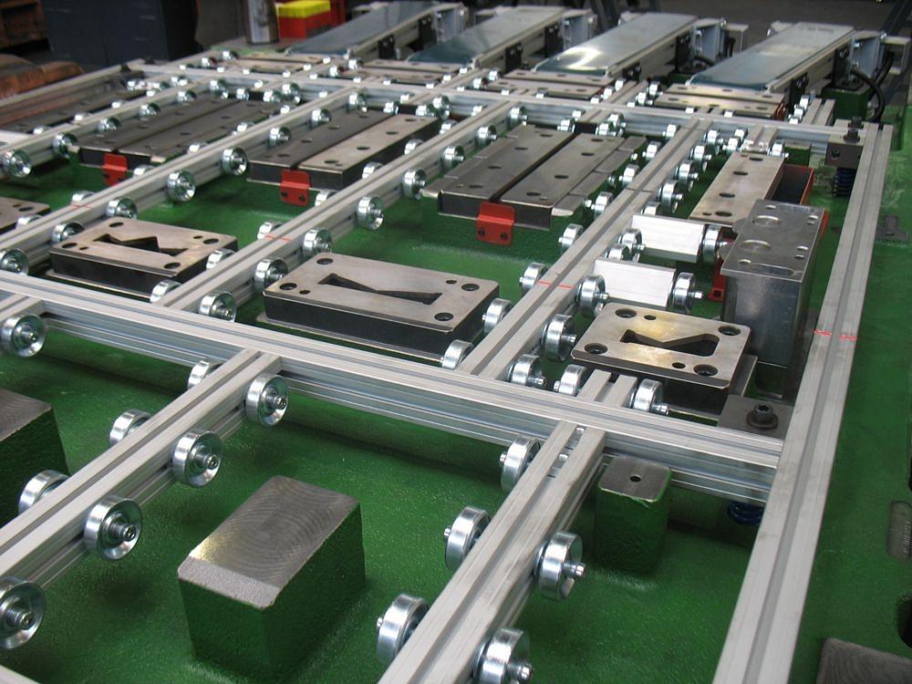 Close-up of a blank cutting tool featuring guide rails and cutting components