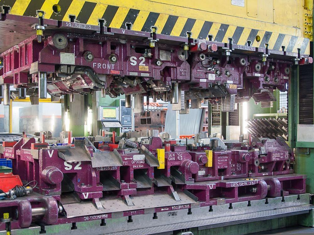 Transfer tool in production – high-precision forming tool in operation Large transfer tool inside a manufacturing line used for forming metal components